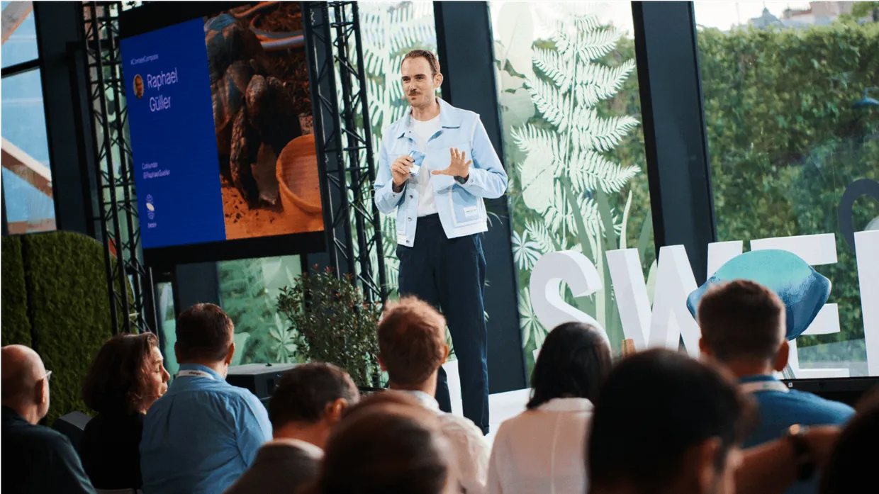 Raphael Gueller speaking at a conference